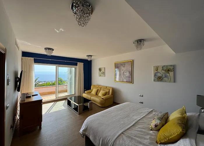 Villa Blossom In The Beautiful Area Of Puerto Santiago Tenerife With 5 Bedrooms For Up To 10 Guests Private Swimming Pool And Many Other Activities To Entertain The Family Secure Parking For 2 Cars And Disabled Access Throughout