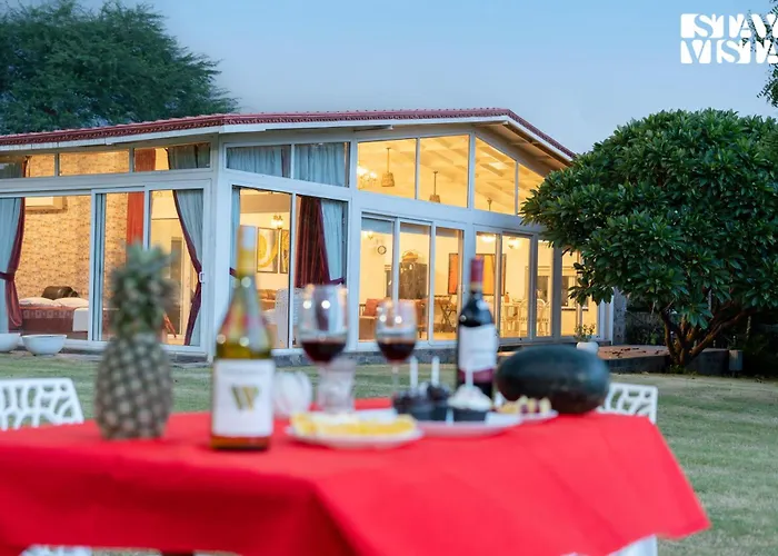 Stayvista's Glasshouse: Orchard Farmstay with Pool and Relaxation