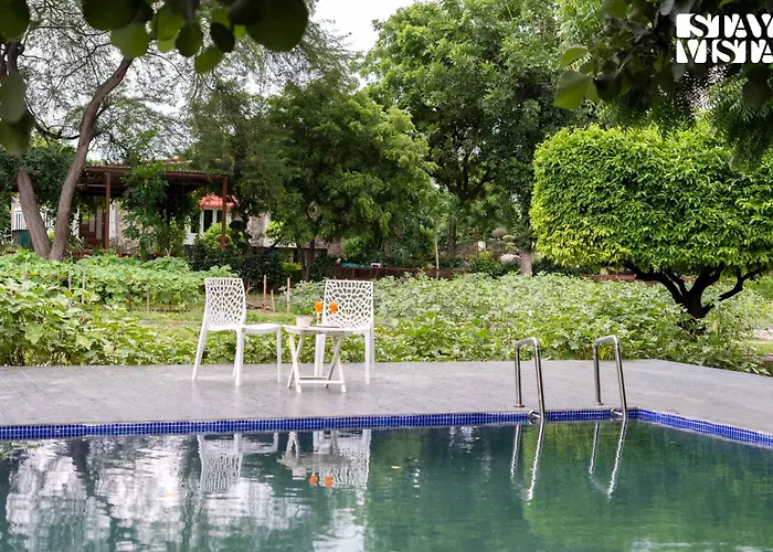 Stayvista's Glasshouse: Orchard Farmstay with Pool and Relaxation